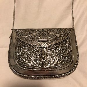 From St Xavier Silver Embossed Metal Mini Bag